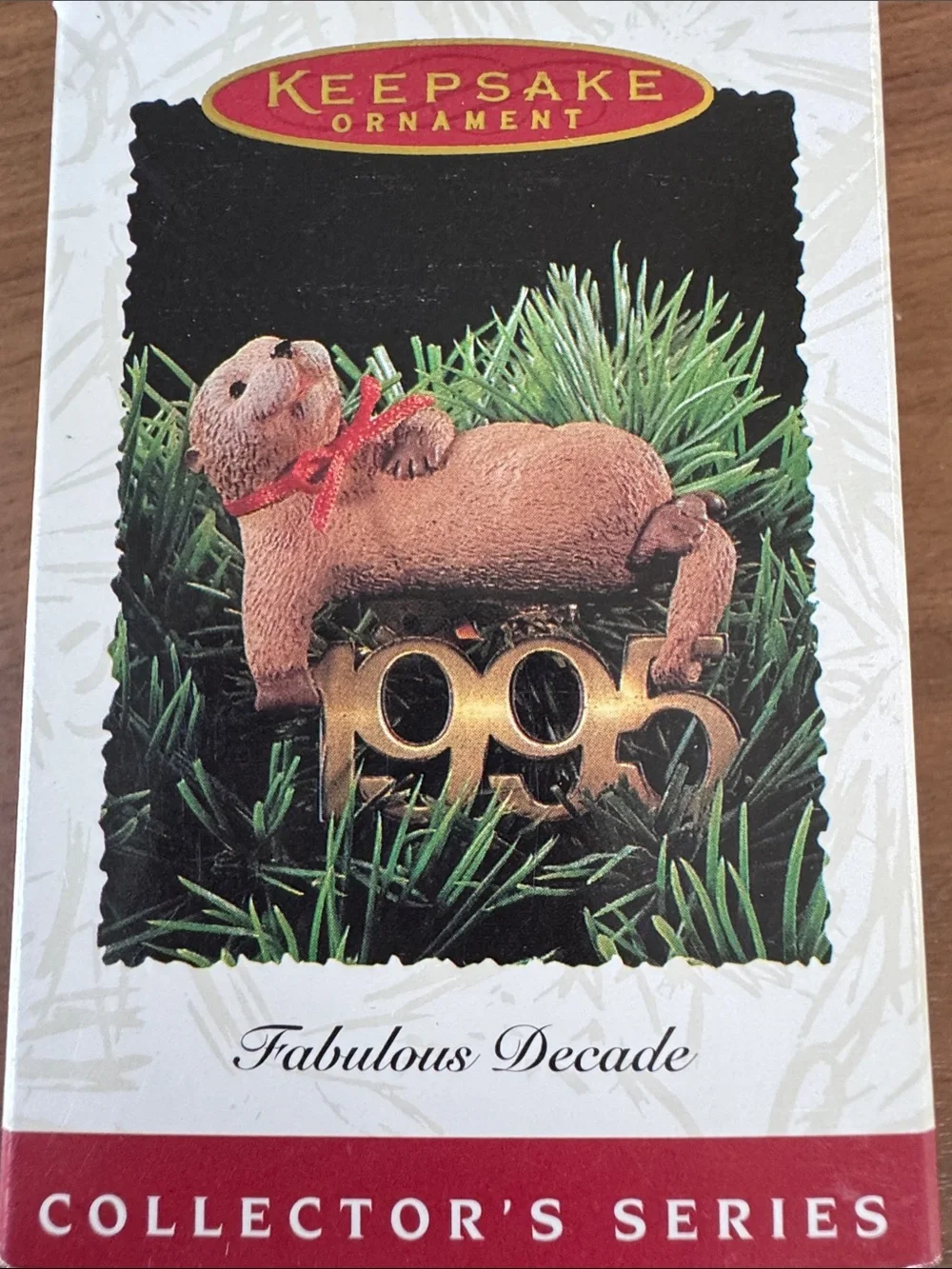 Hallmark Fabulous Decade Ornament Brown Otter with Red Bow and Gold 1995 Accent